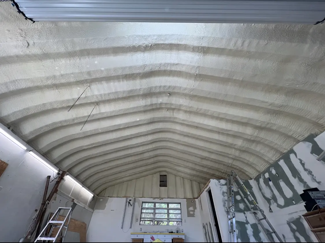 Spray polyurethane foam applied to the underside of a metal roof deck in East Providence
